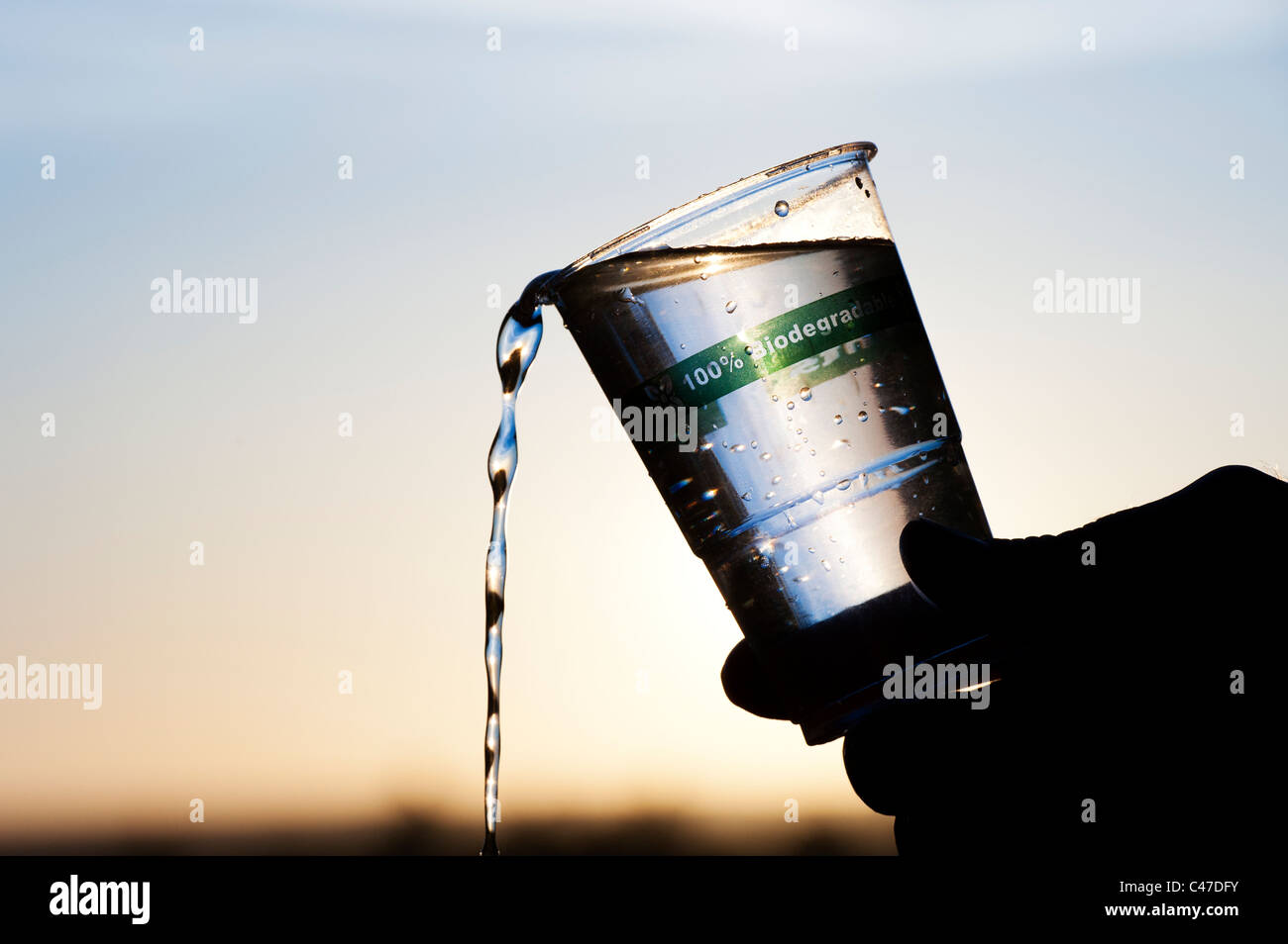 Pouring water from a Biodegradable, Compostable plastic free cup made