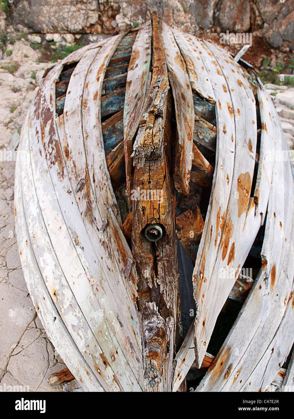 The wrecked wooden hull of a boat on the beach. Stock Photo