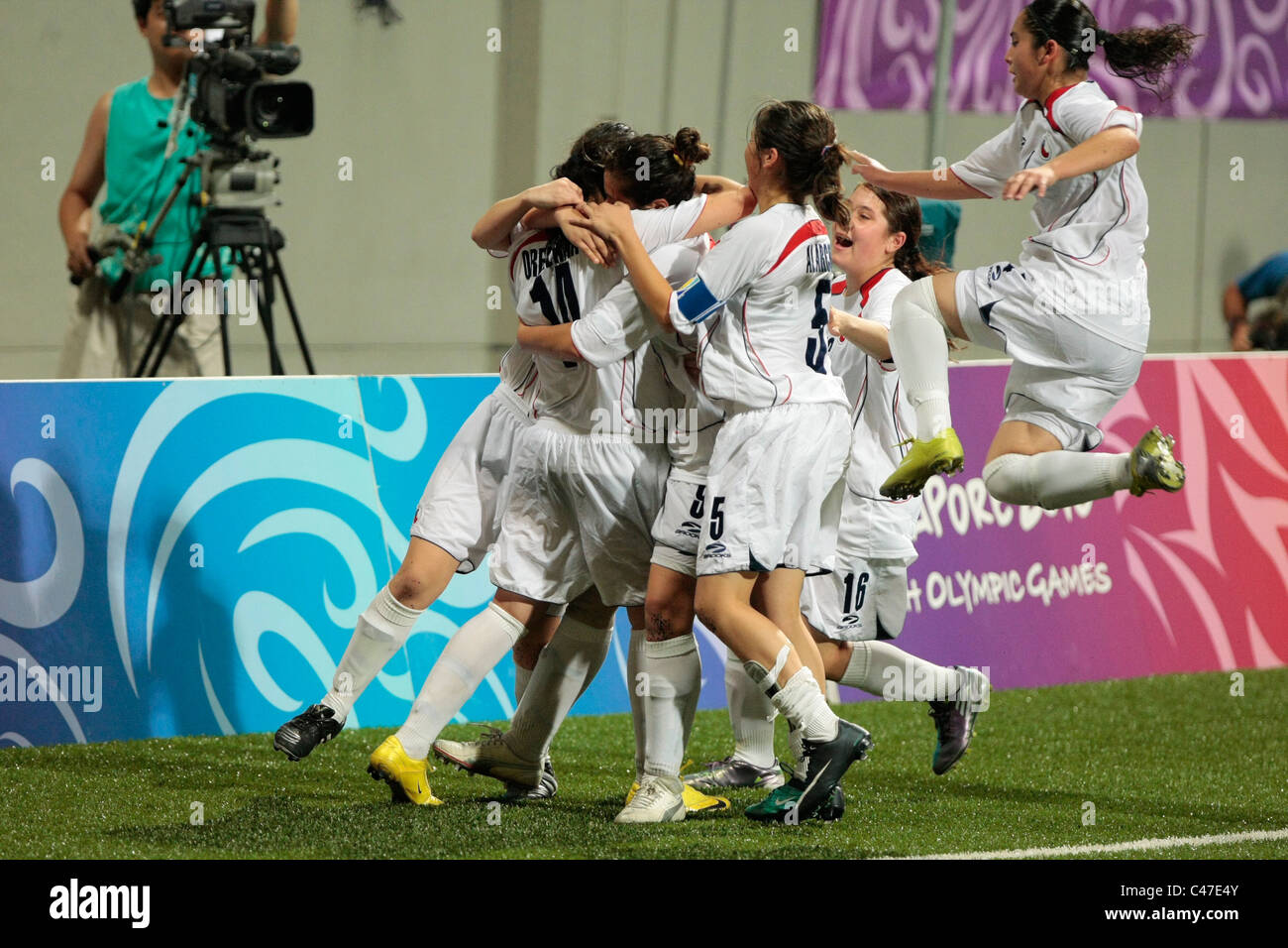 The Chilean players reacting to winning the penalty kick-off during the Women's Finals between Chile and Equatorial Guinea. Stock Photo