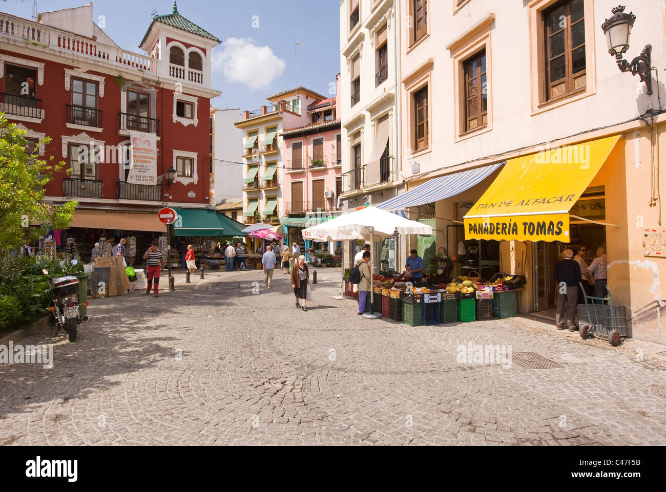 A traditional plaza with small shops in Granada Andalucia Spain Stock