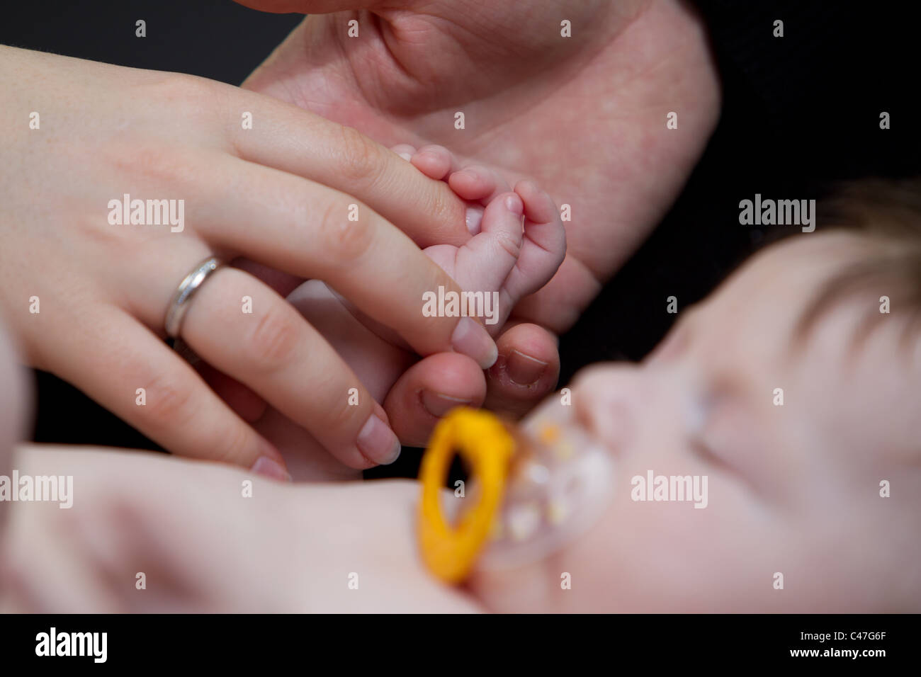 Details of hands from baby girl, mother, father Stock Photo - Alamy