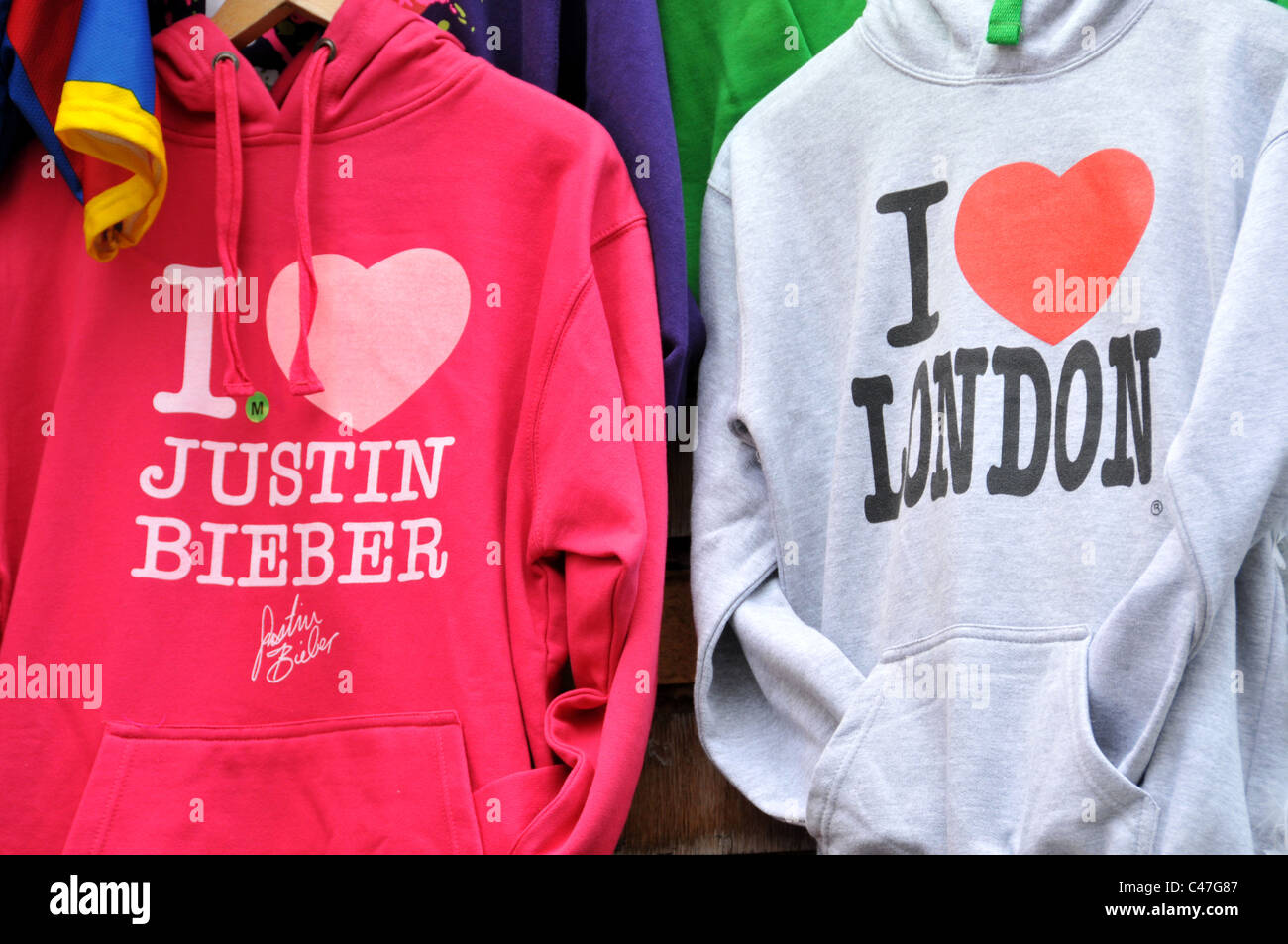 Justin Bieber London 'I Love London' hooded tops tourist gifts London market stall Stock Photo