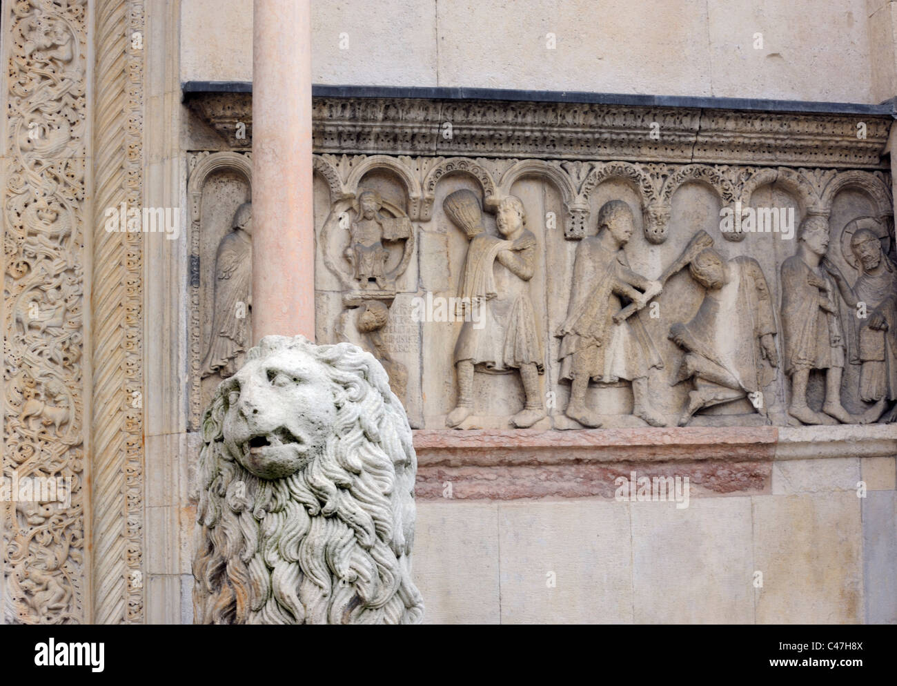 A Roman Lion guarding the West door of the Modena Cathedral Stock Photo