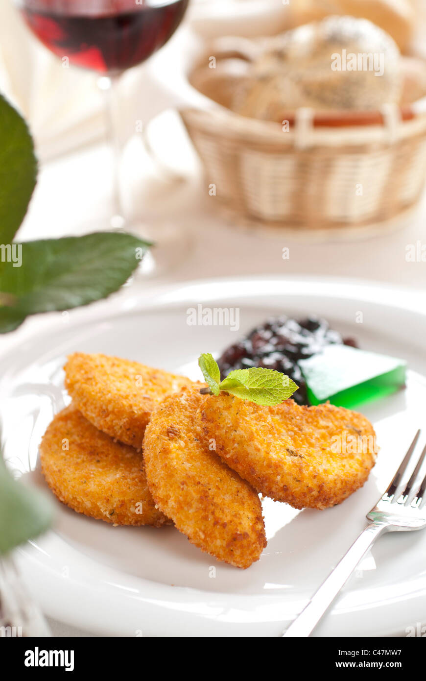 fried cheese and a jam with red wine and bread Stock Photo