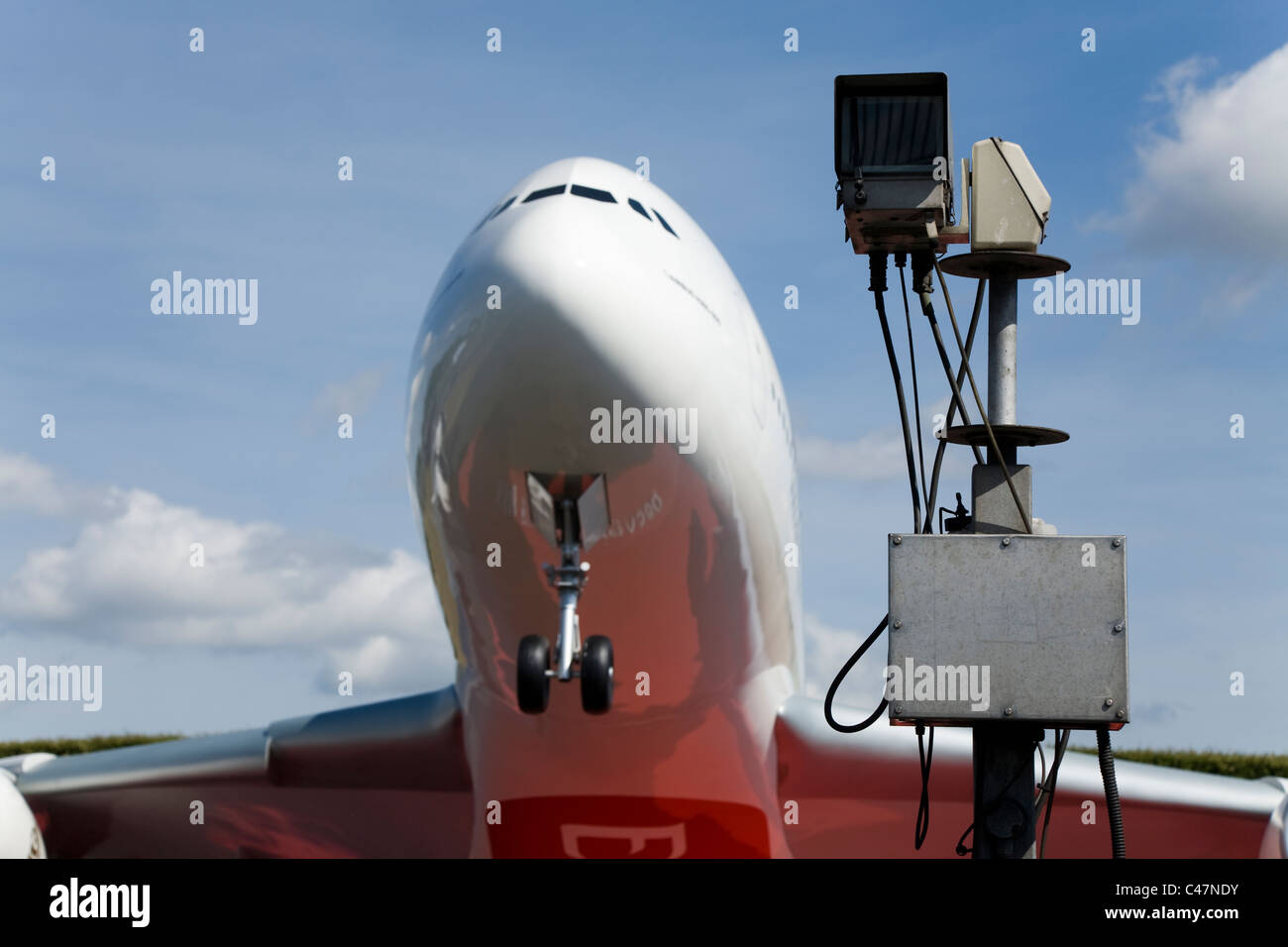Security traffic camera / CCTV surveillance cameras / near the Emirates Airbus A380 model aircraft at London Heathrow airport UK Stock Photo