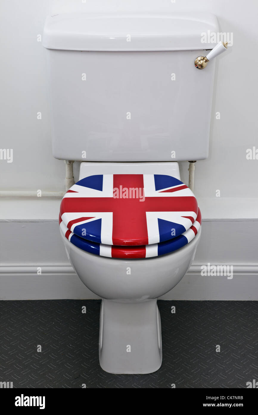A white lavatory with a seat painted in a union flag design. Stock Photo