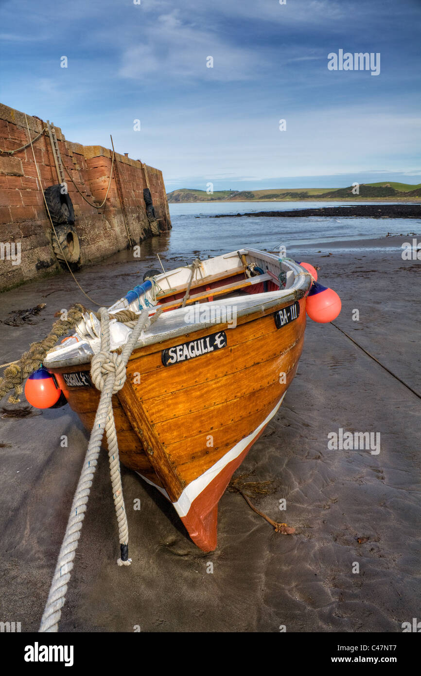Small fishing boat called "seagull" moored to jetty within the Ayrshire