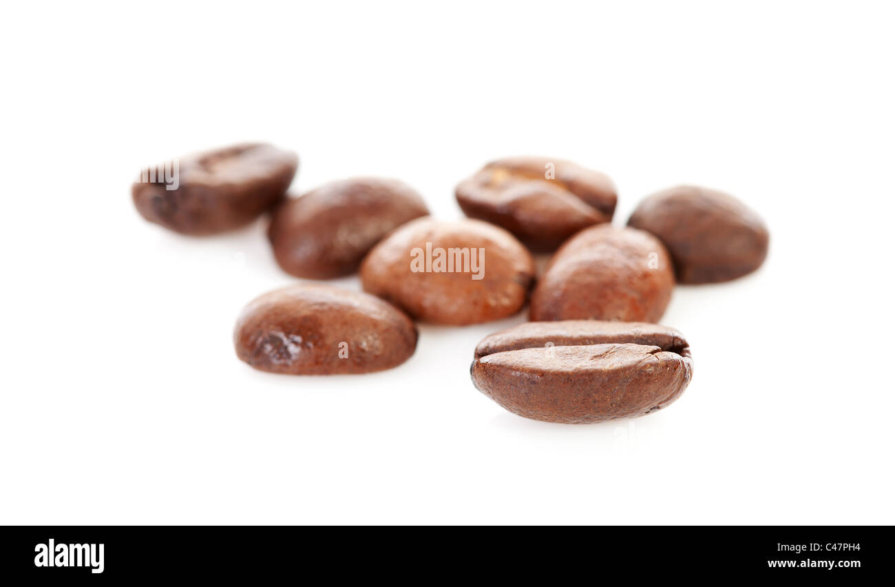 Macro of fresh roasted coffee beans over white background Stock Photo ...