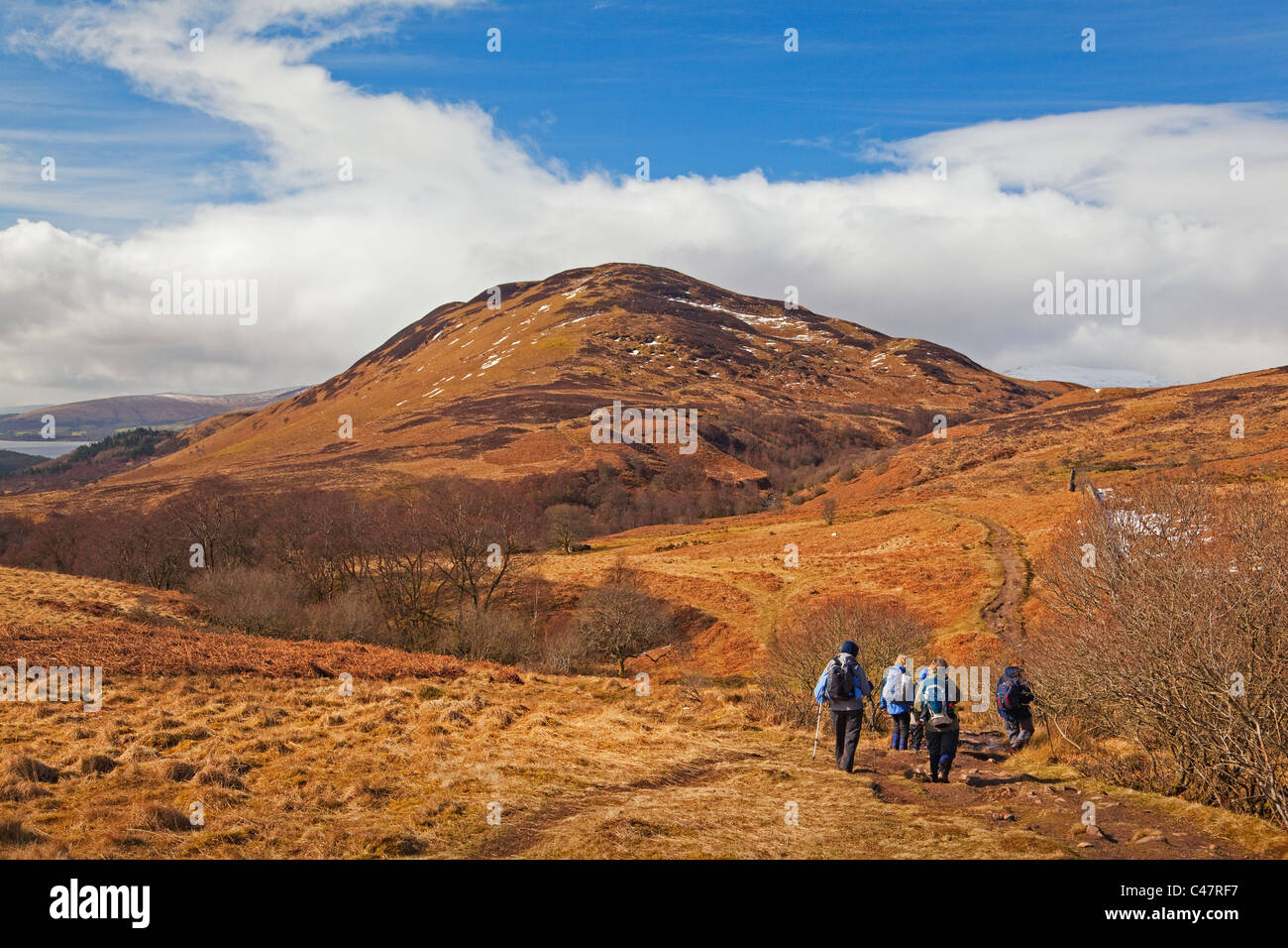 Walkers approaching Conic Hill on the West Highland Way Stock Photo