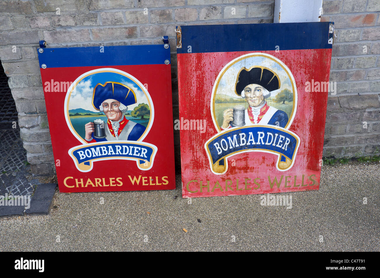 Old and new Bombardier pub signs Stock Photo