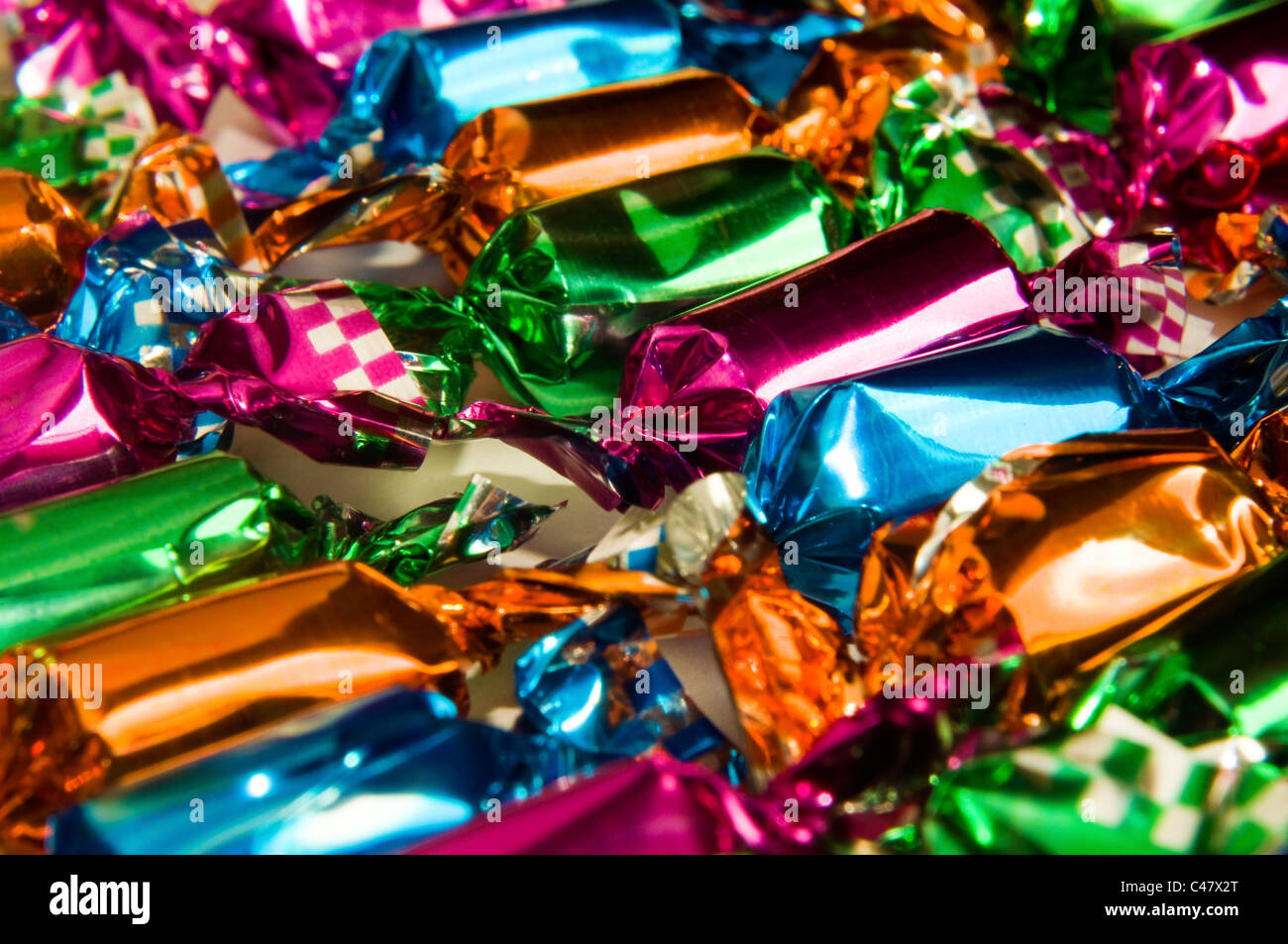 Cellophanewrapped toffees Stock Photo Alamy