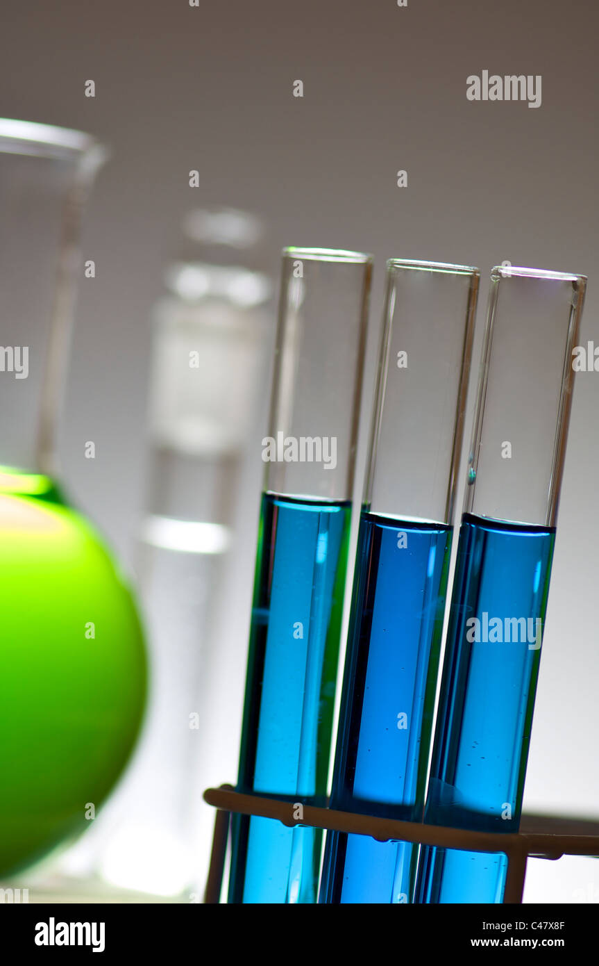 blue test tubes and bottles with white background Stock Photo Alamy