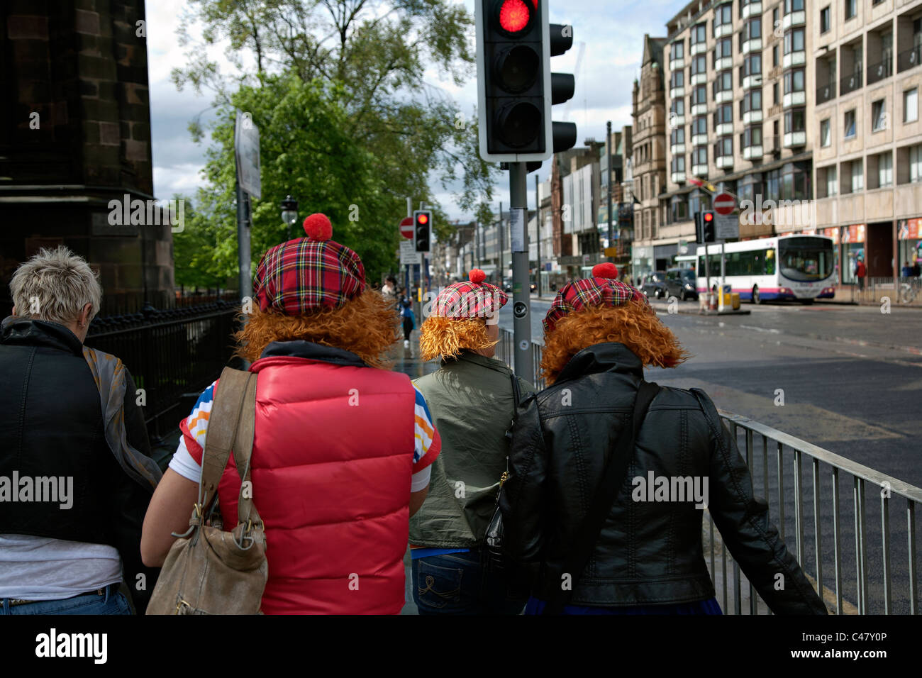 tourists wearing jimmy hats in edinburgh Stock Photo