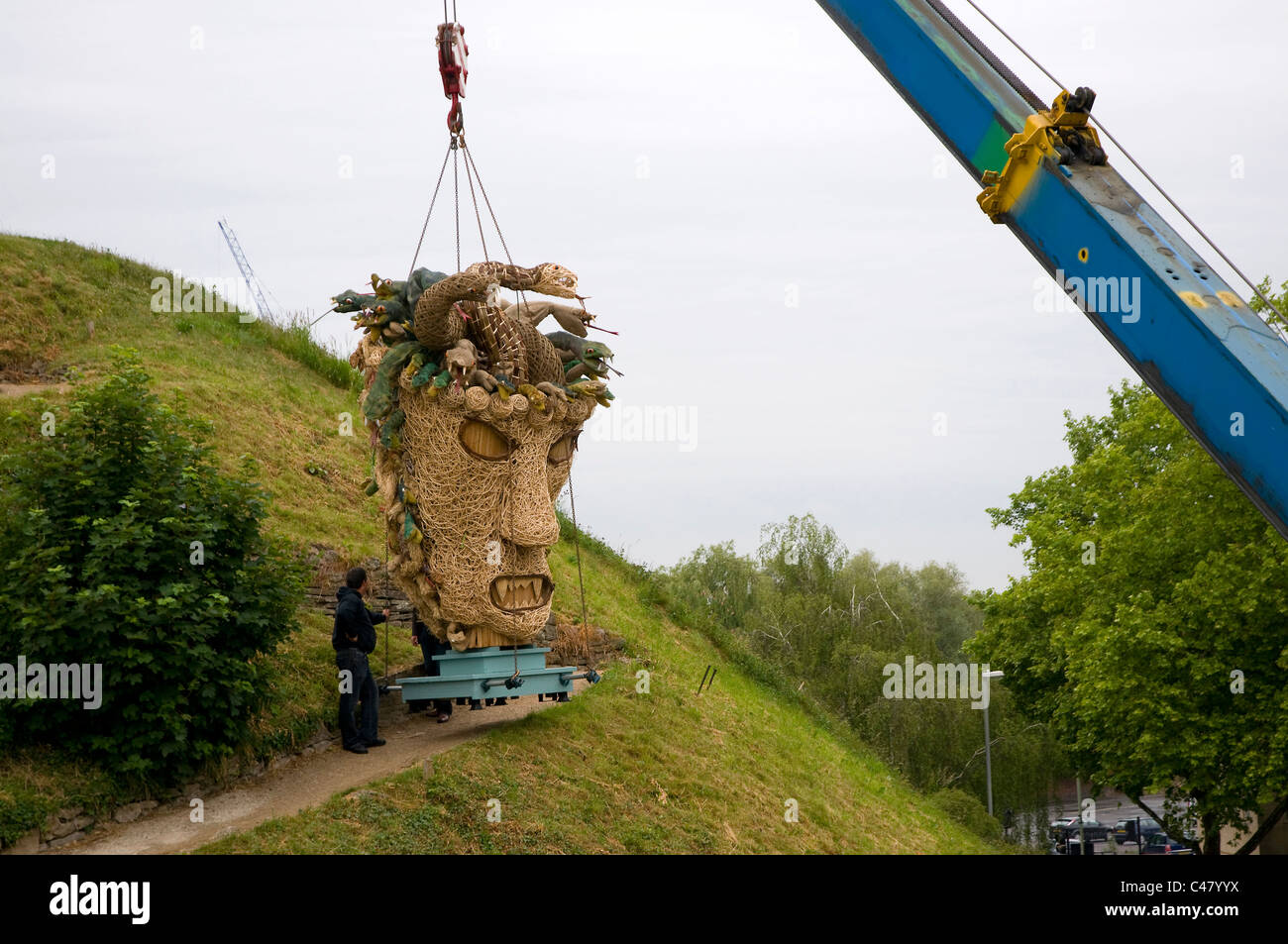 The head of a wicker man in the form of Medusa being craned onto the castle mound in Oxford. Raising money for Charity. Stock Photo