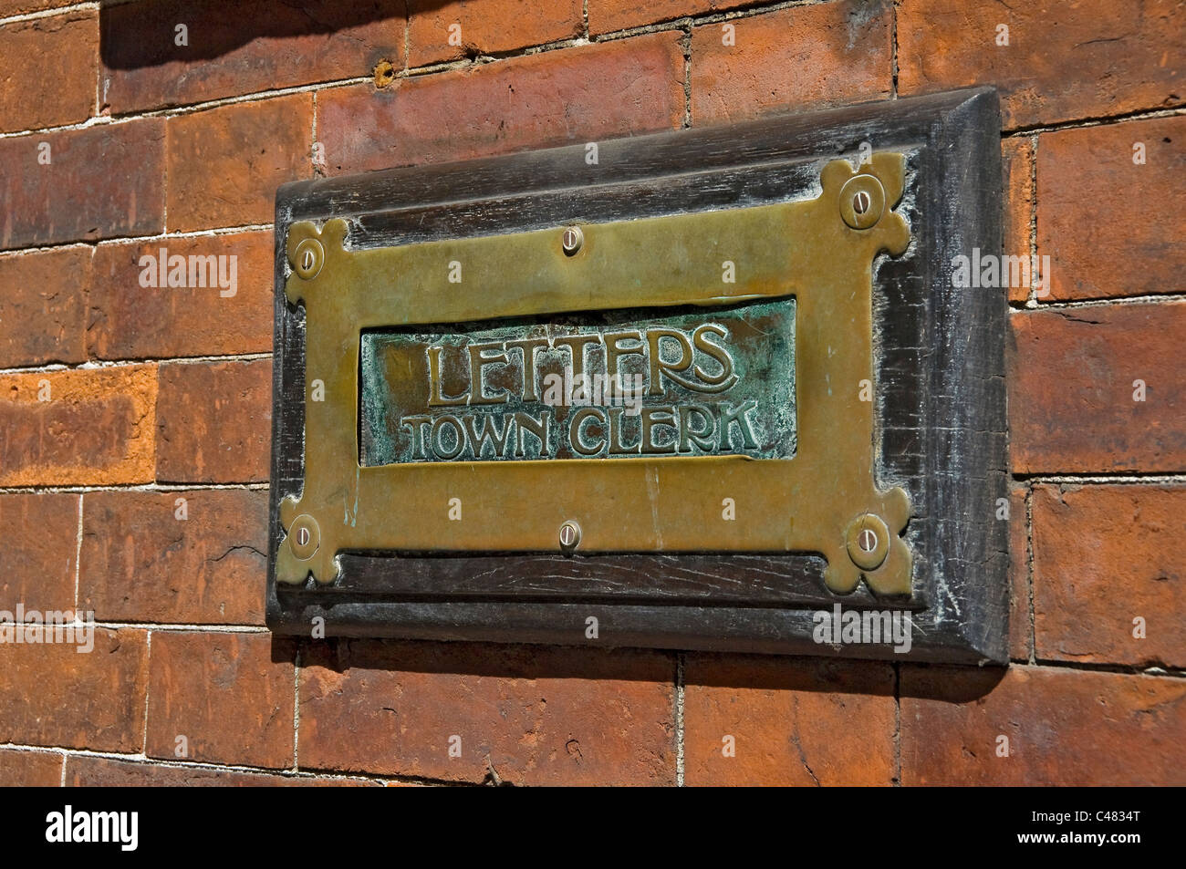 Close up of old traditional brass letterbox for the Town Clerk Scarborough North Yorkshire England UK United Kingdom GB Great Britain Stock Photo