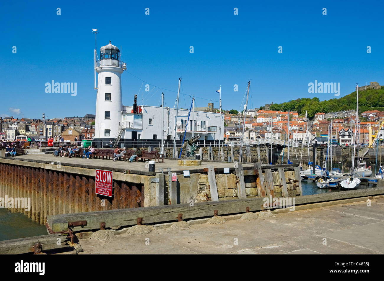 Scarborough lighthouse and harbour in spring North Yorkshire England UK United Kingdom GB Great Britain Stock Photo