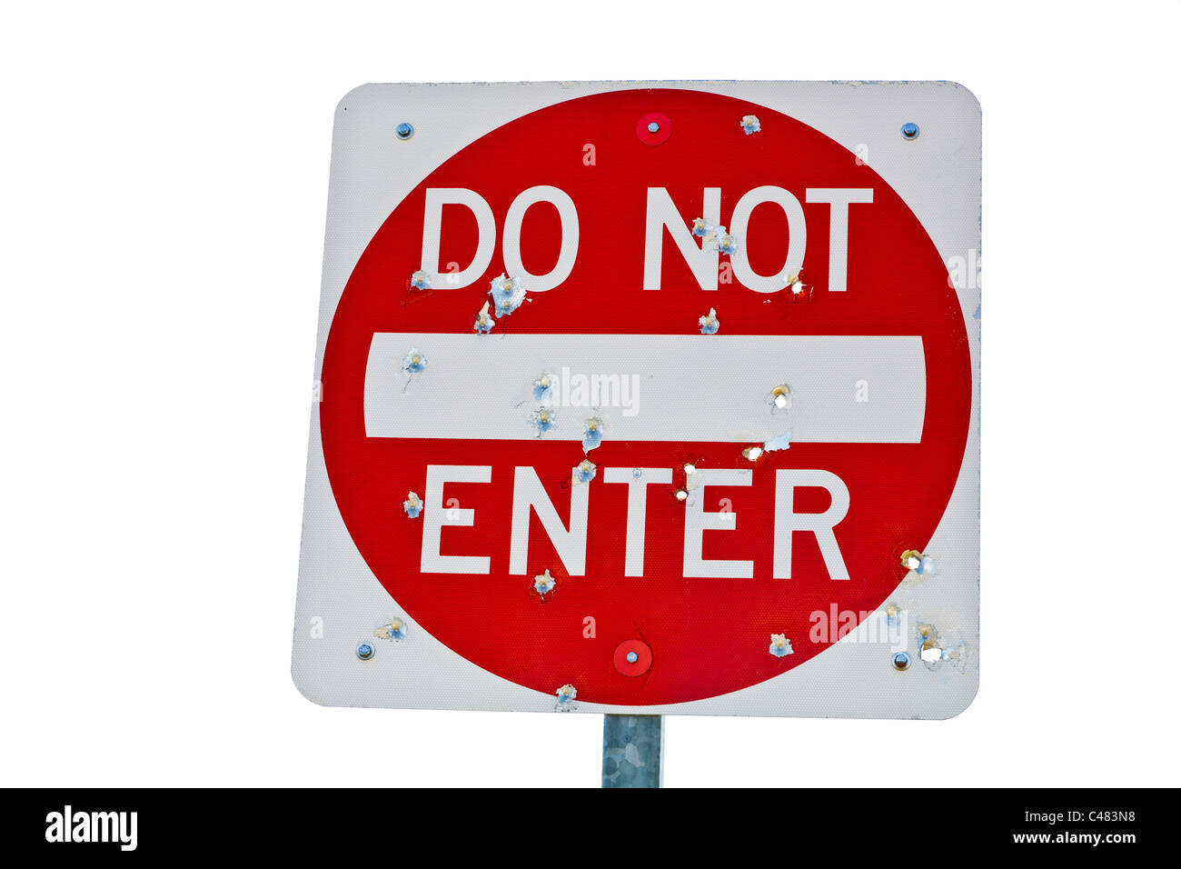 Do Not Enter road sign with numerous bullet holes Stock Photo