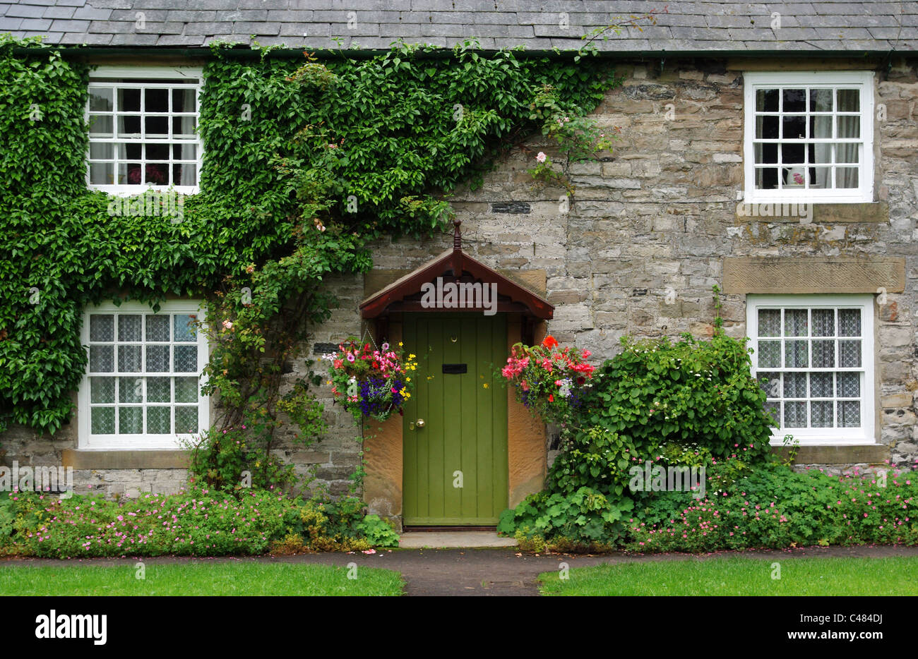 Bridge House, a stone built cottage in the pretty Derbyshire village of