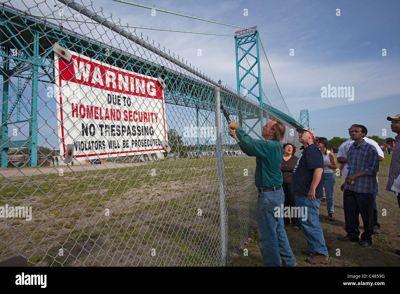 Community Activists Remove Fence Illegally Erected in Name of 'Homeland Security' Stock Photo