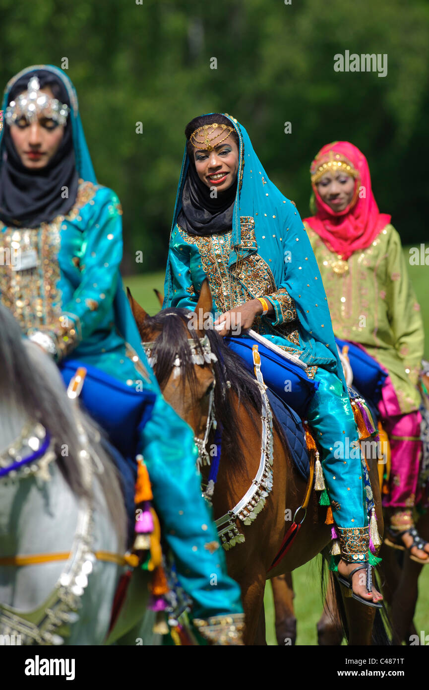 arabian Royal Cavalry of Oman in original costume on arabic horse while a public show