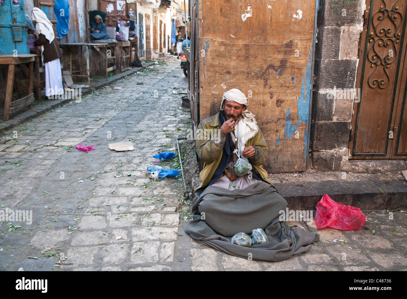 A khat seller in the Old city of Sana'a, Yemen. Stock Photo