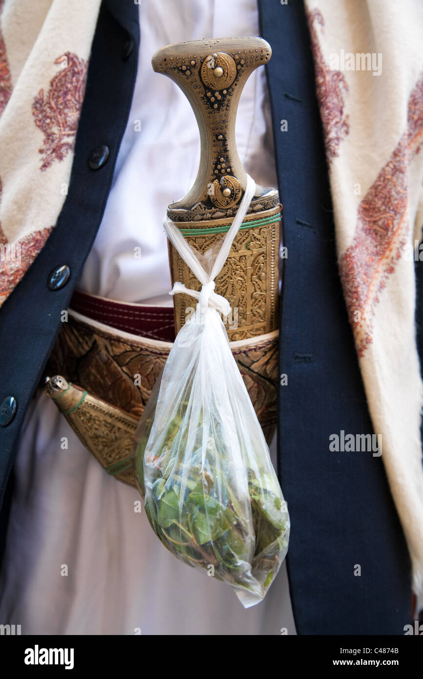 A detail of dagger (jambia) and a bag of khat of a man wearing traditional Yemeni clothes in Sana'a, Yemen. Stock Photo