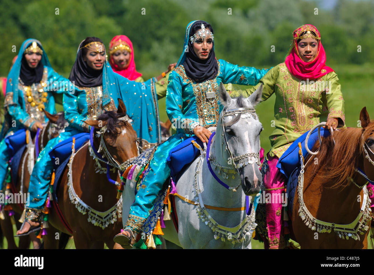 arabian Royal Cavalry of Oman in original costume on arabic horse while a public show performance in Munich, Germany Stock Photo