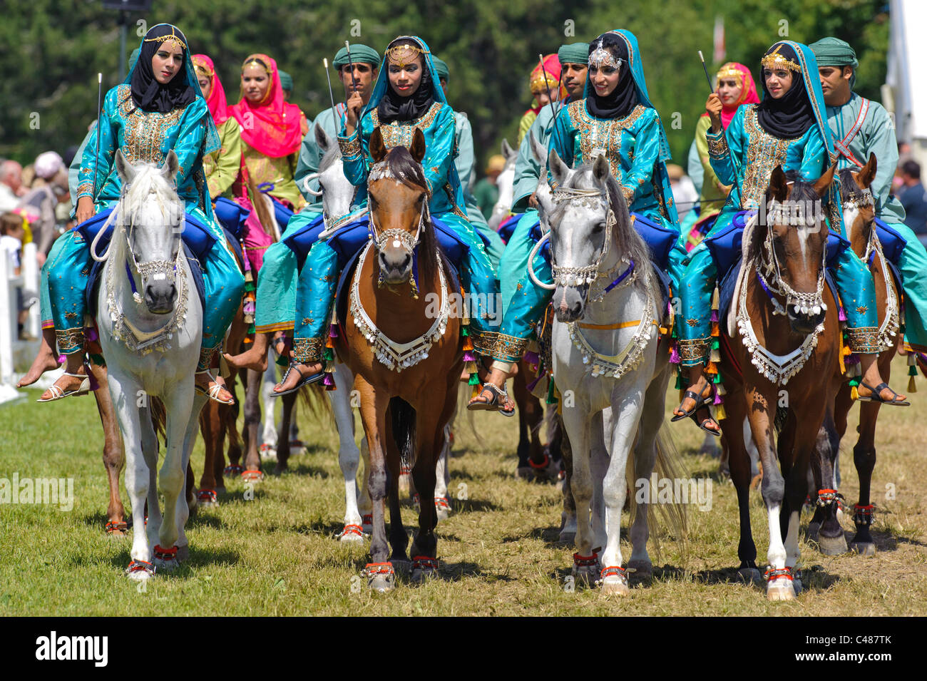 arabian Royal Cavalry of Oman in original costume on arabic horse while a public show