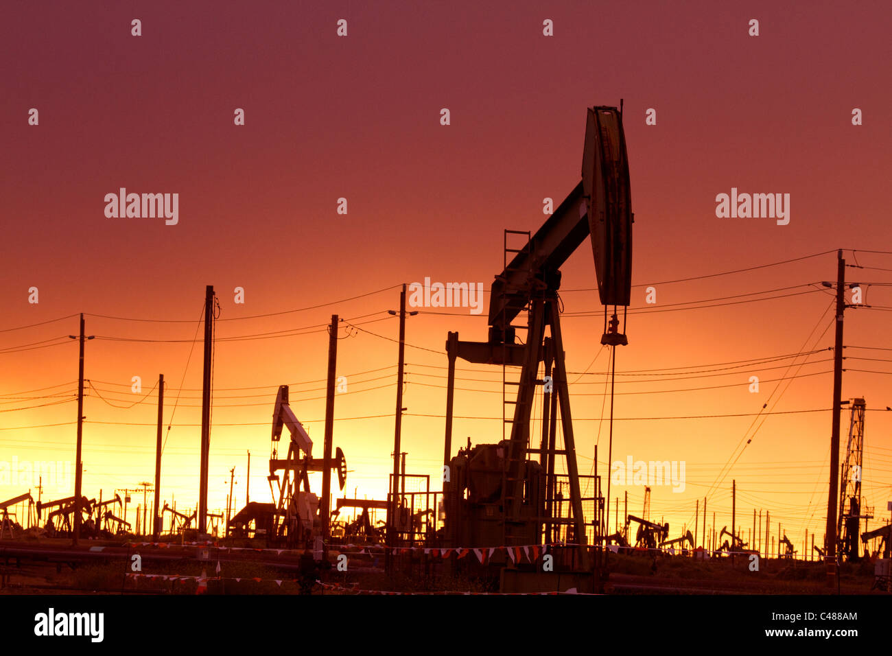 Oil Pumps at work in oil and gas field USA Stock Photo Alamy
