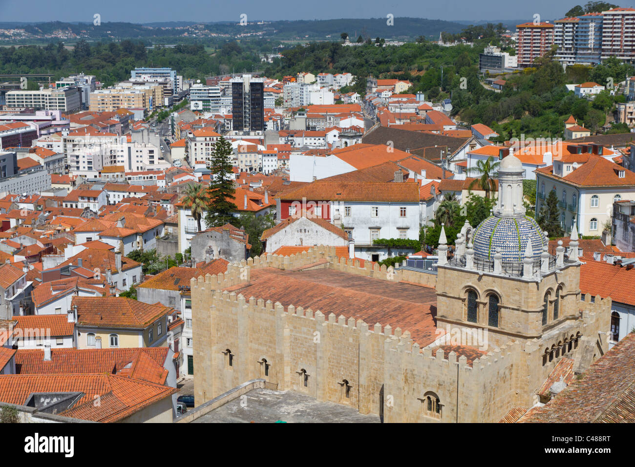 cityscape over the roofs of Coimbra with mighty cathedral se velha de Coimbra, Portugal Stock Photo