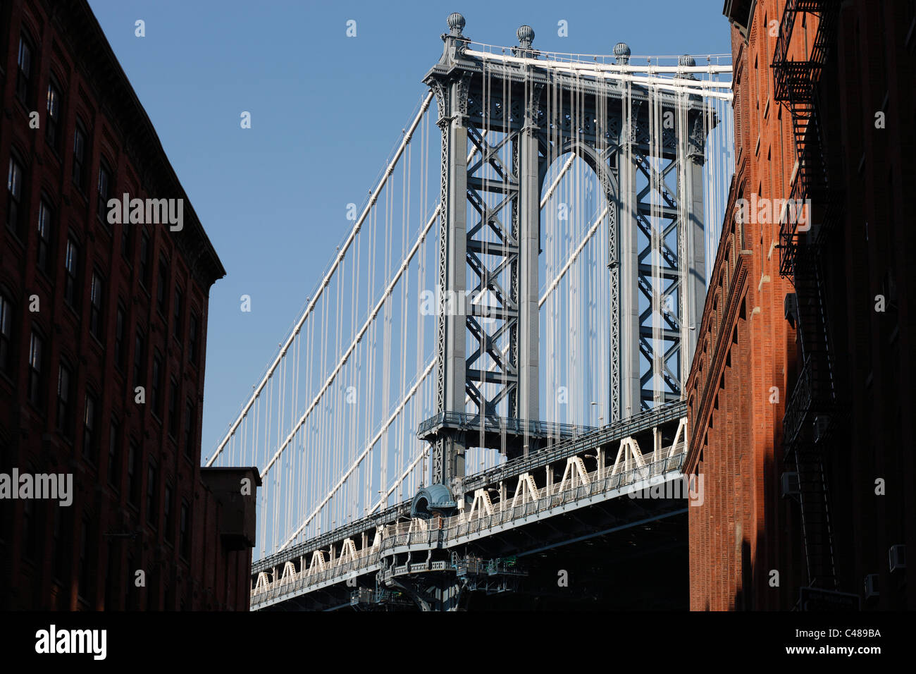 The Manhattan Bridge seen from a street canyon, New York City, USA Stock Photo