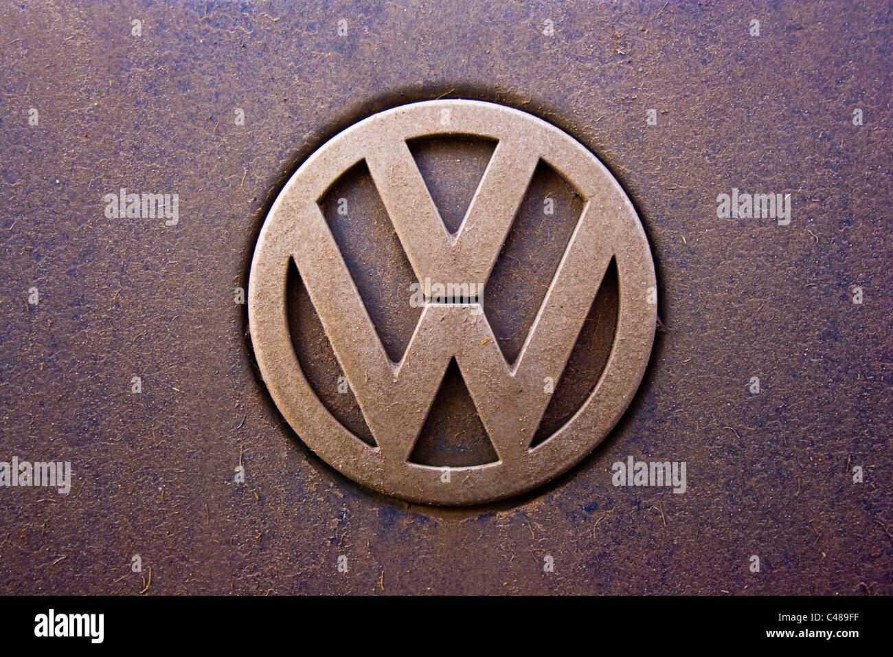 A Volkswagen logo looking rather dirty from the use of the car on which it is featured. (Editorial use only). Stock Photo
