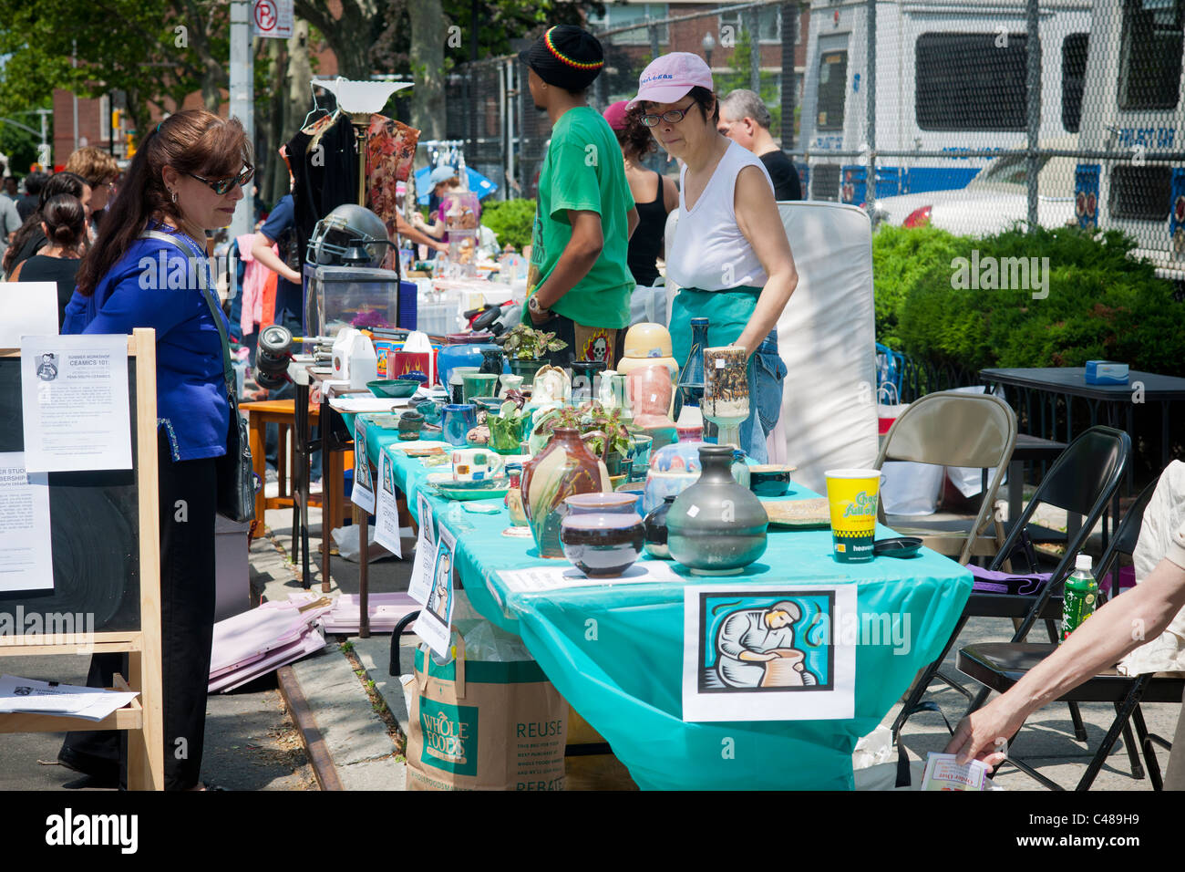 Shoppers search for bargains at a flea market in the New York neighborhood of Chelsea Stock Photo