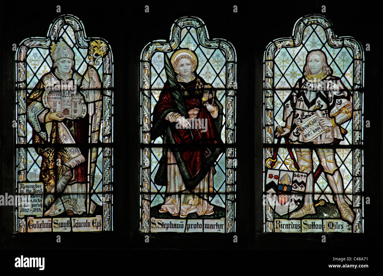 A stained glass window by The Kempe Studios depicting Bishop Smythe, St Stephen & Richard Sutton, Church of St Peter & St Paul, Steeple Aston, Oxford Stock Photo