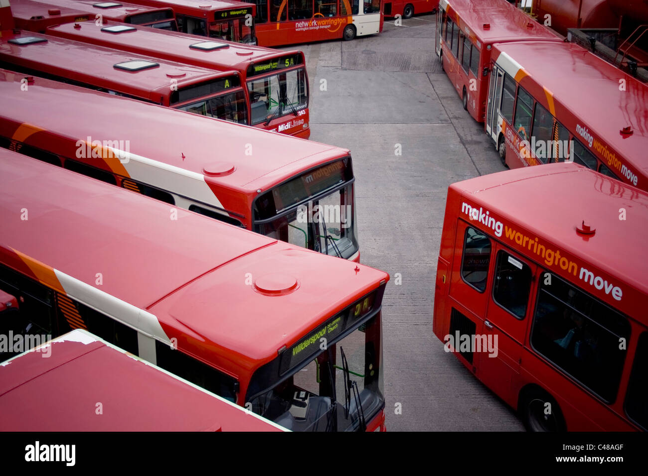 A number of Warrington buses sit parked in a depot during a public holiday. Stock Photo