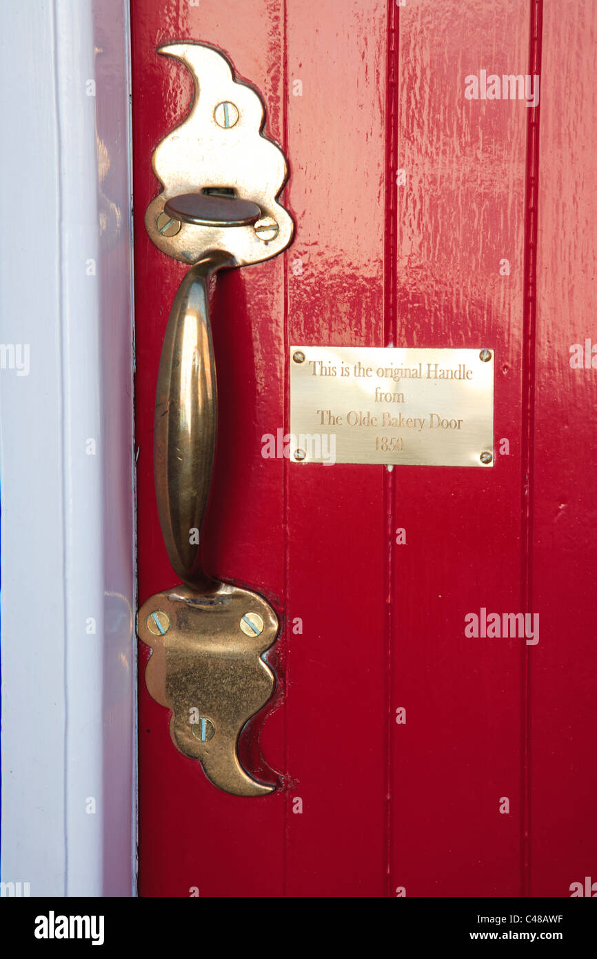 Red door with brass plaque Kinsale County Cork Ireland Stock Photo