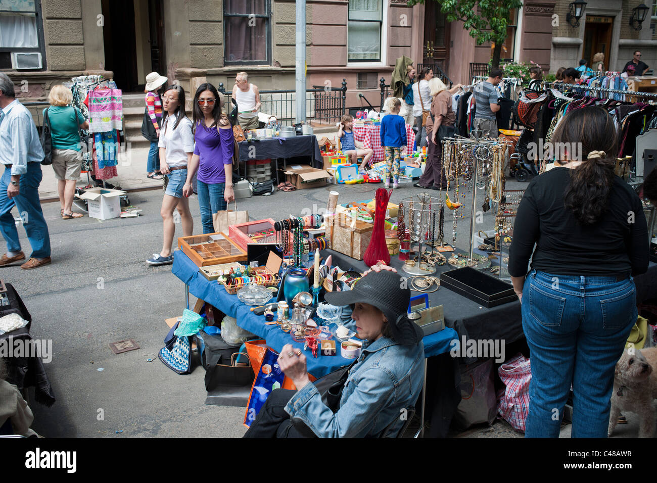 Shoppers search for bargains at the Jane Street Block Association Flea Market in the New York neighborhood of Greenwich Village Stock Photo