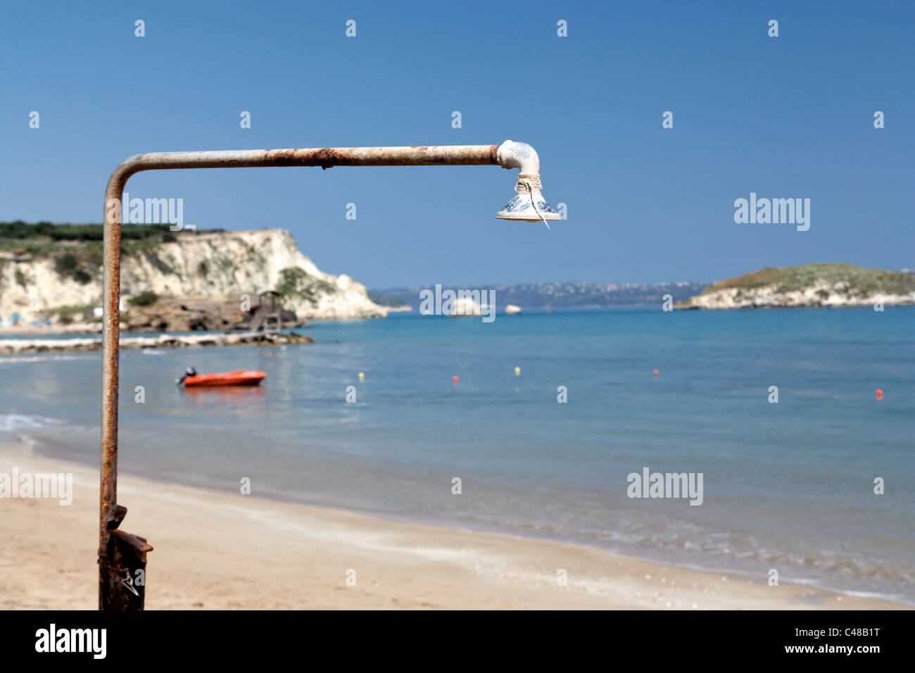 Old rusty shower at the beach of Almirida on Crete, Greece. Stock Photo