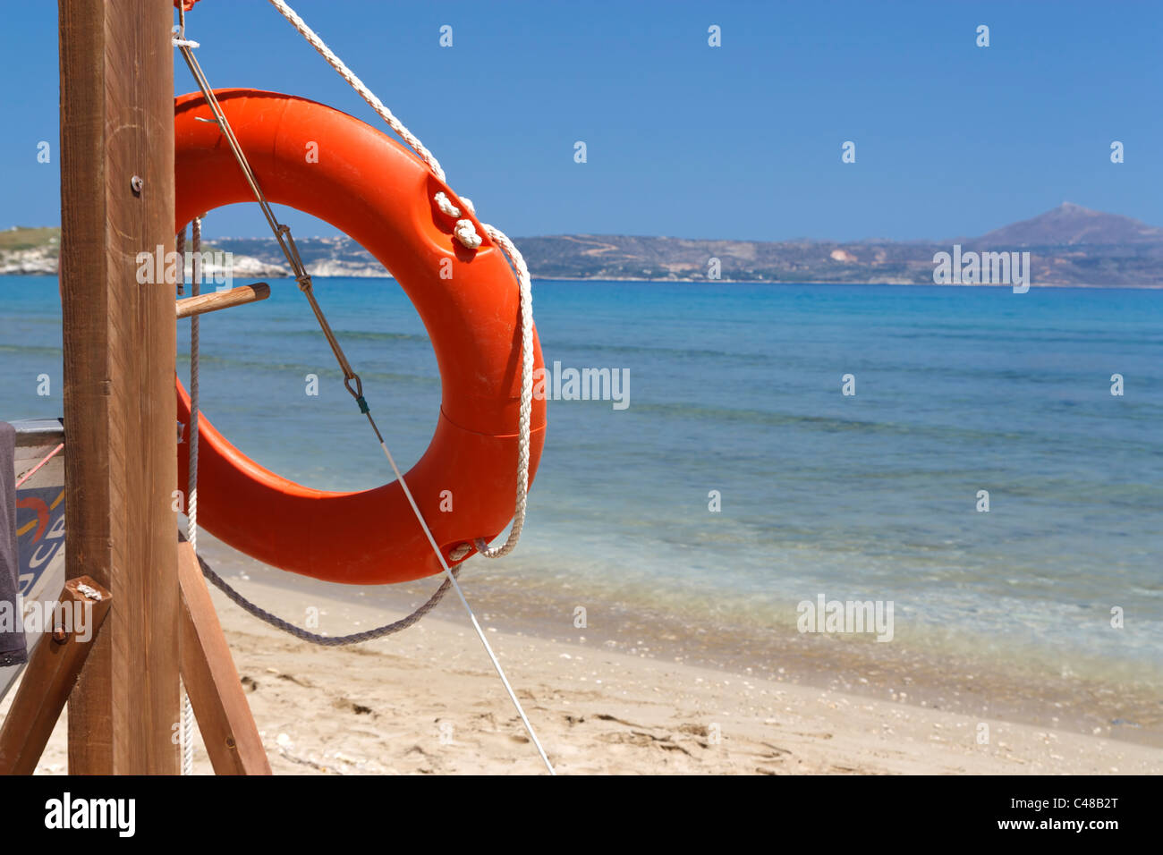 Orange life-saver at the beach of Almirida, Crete, Greece. Stock Photo