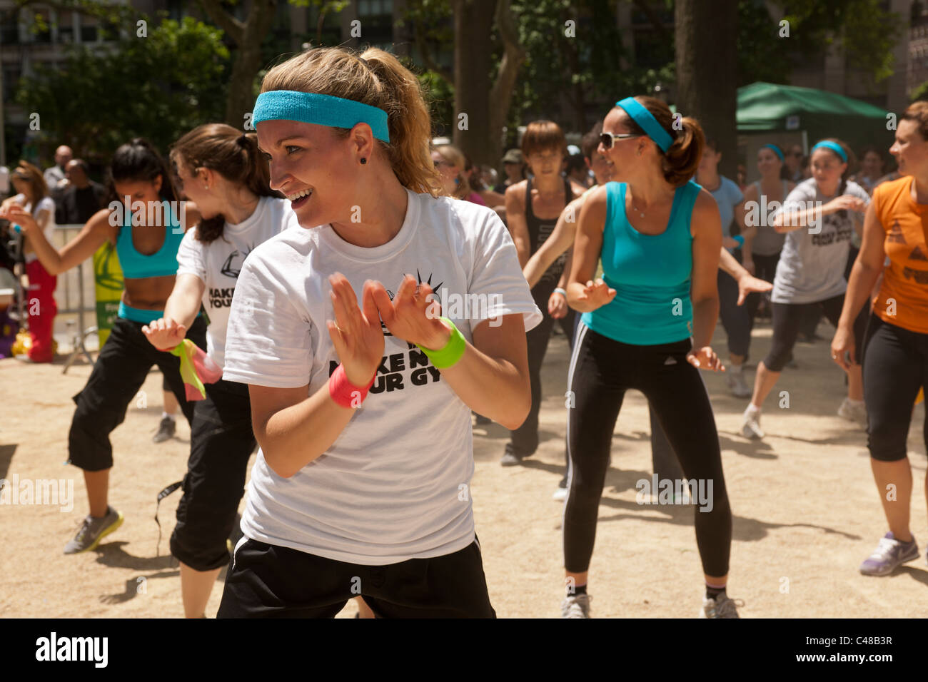 Exercisers participate in a Zumba class in Madison Square Park in New
