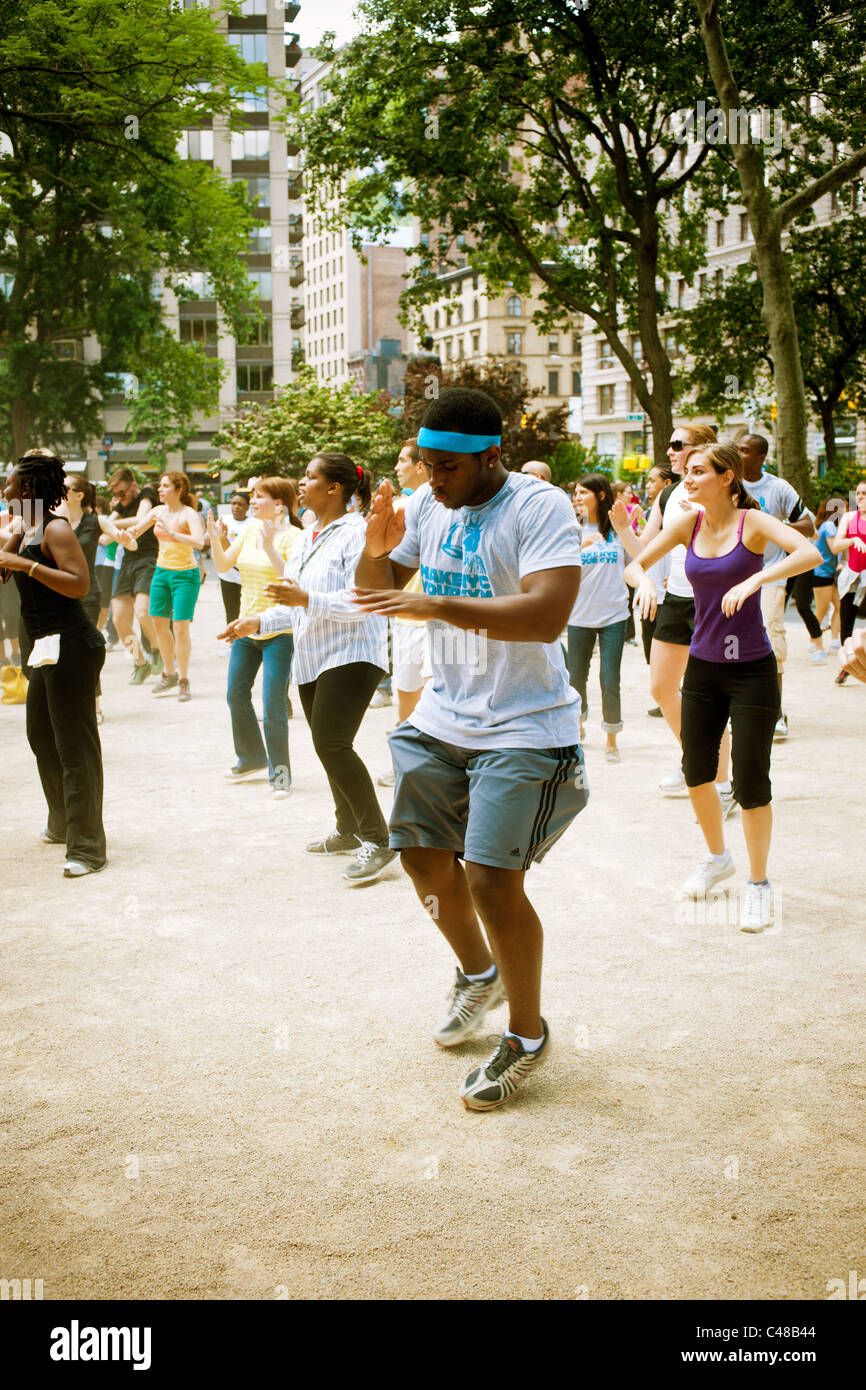 Exercisers participate in a Zumba class in Madison Square Park in New