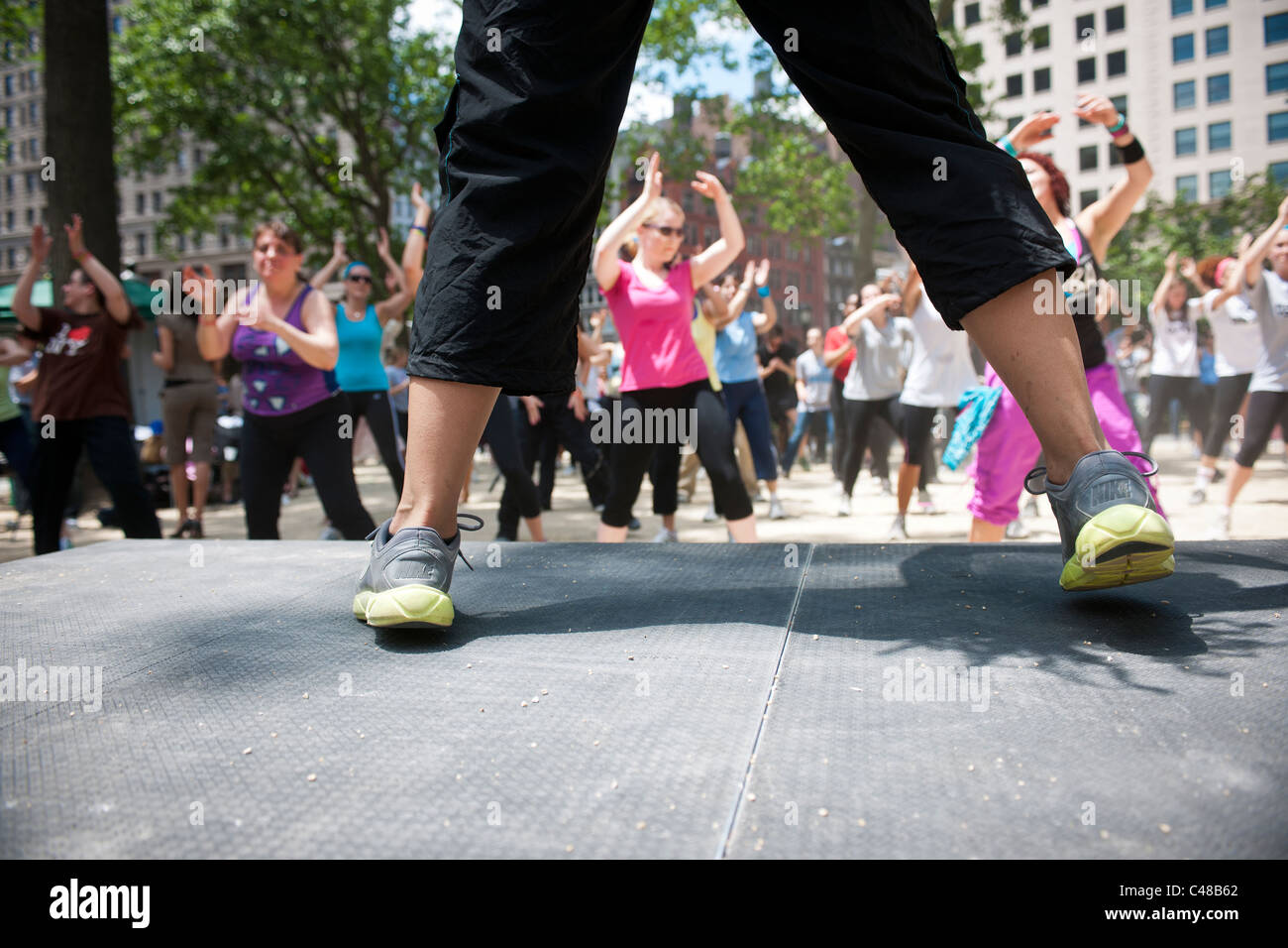 Exercisers participate in a Zumba class in Madison Square Park in New