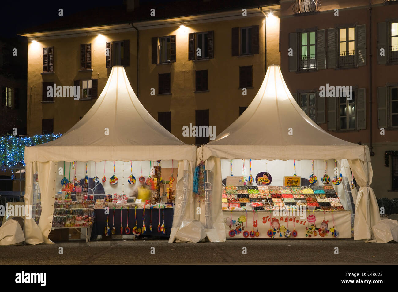 Sweets kiosks at Piazza Volta at night. Como on Lake Como. Lombardy. Italy. Stock Photo