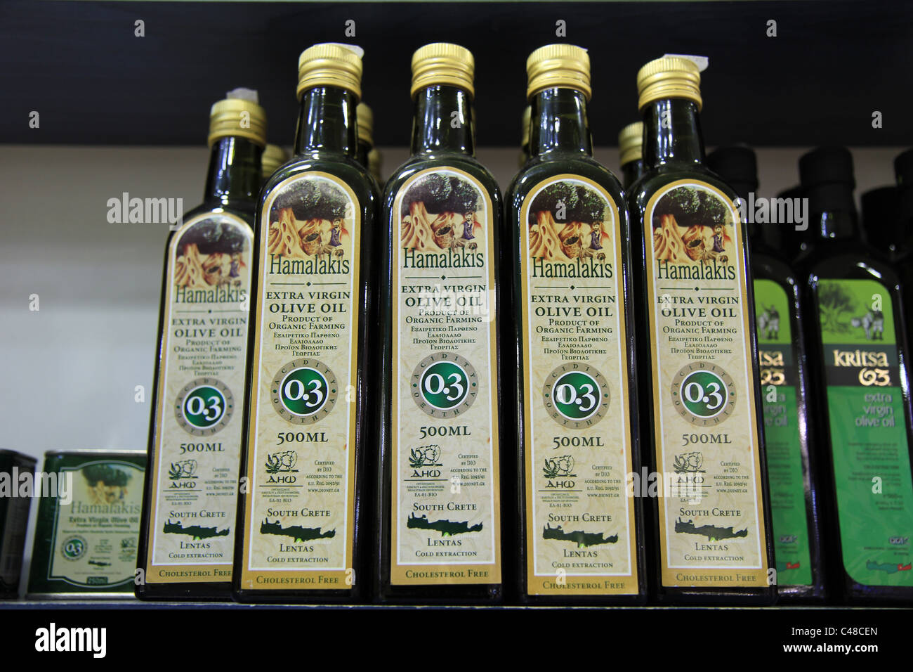 Greek olive oil bottles displayed on shelf Stock Photo Alamy