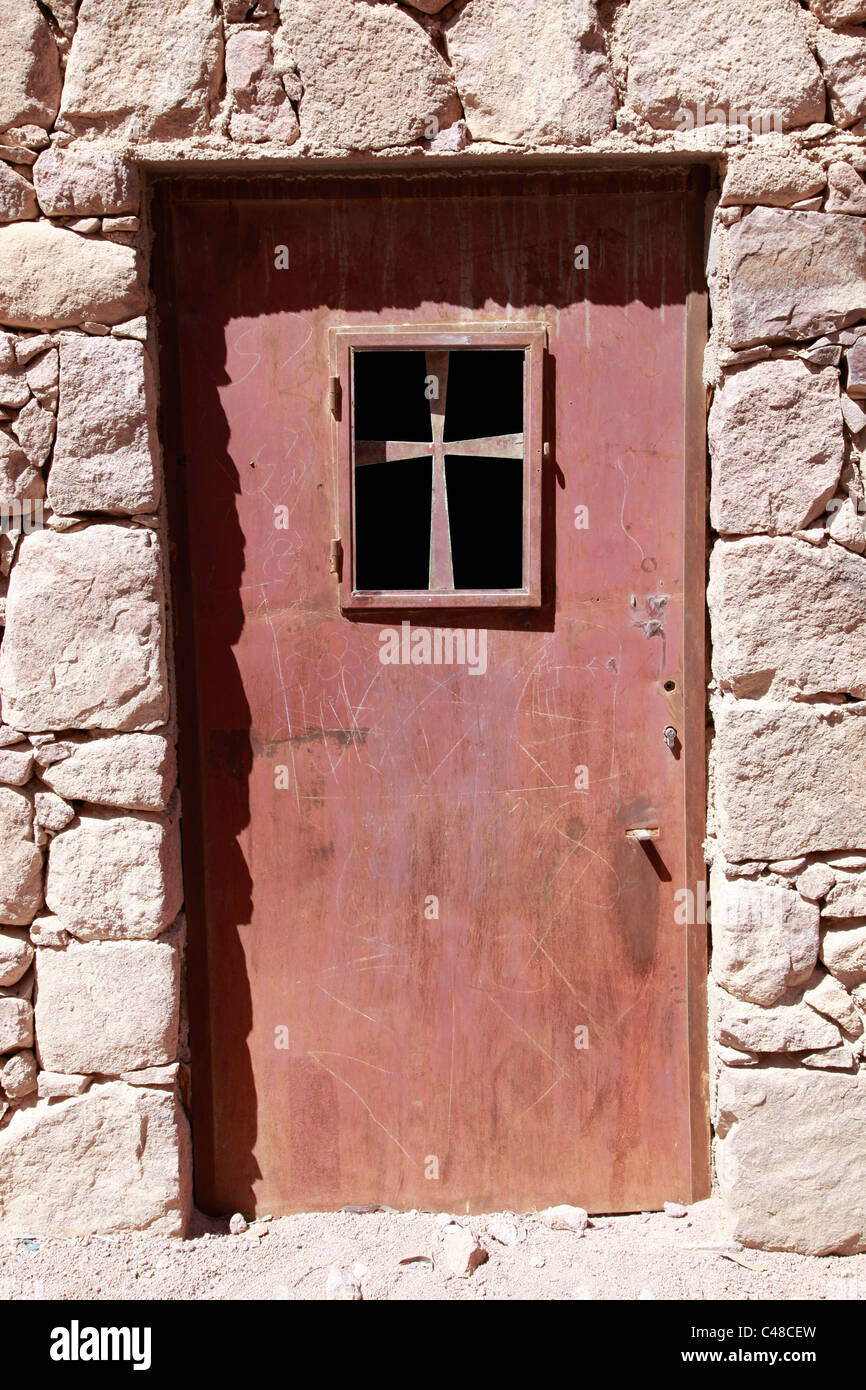 Metal door in with Christian cross at St. Catherine's Monastery, South Sinai Peninsula, Egypt Stock Photo