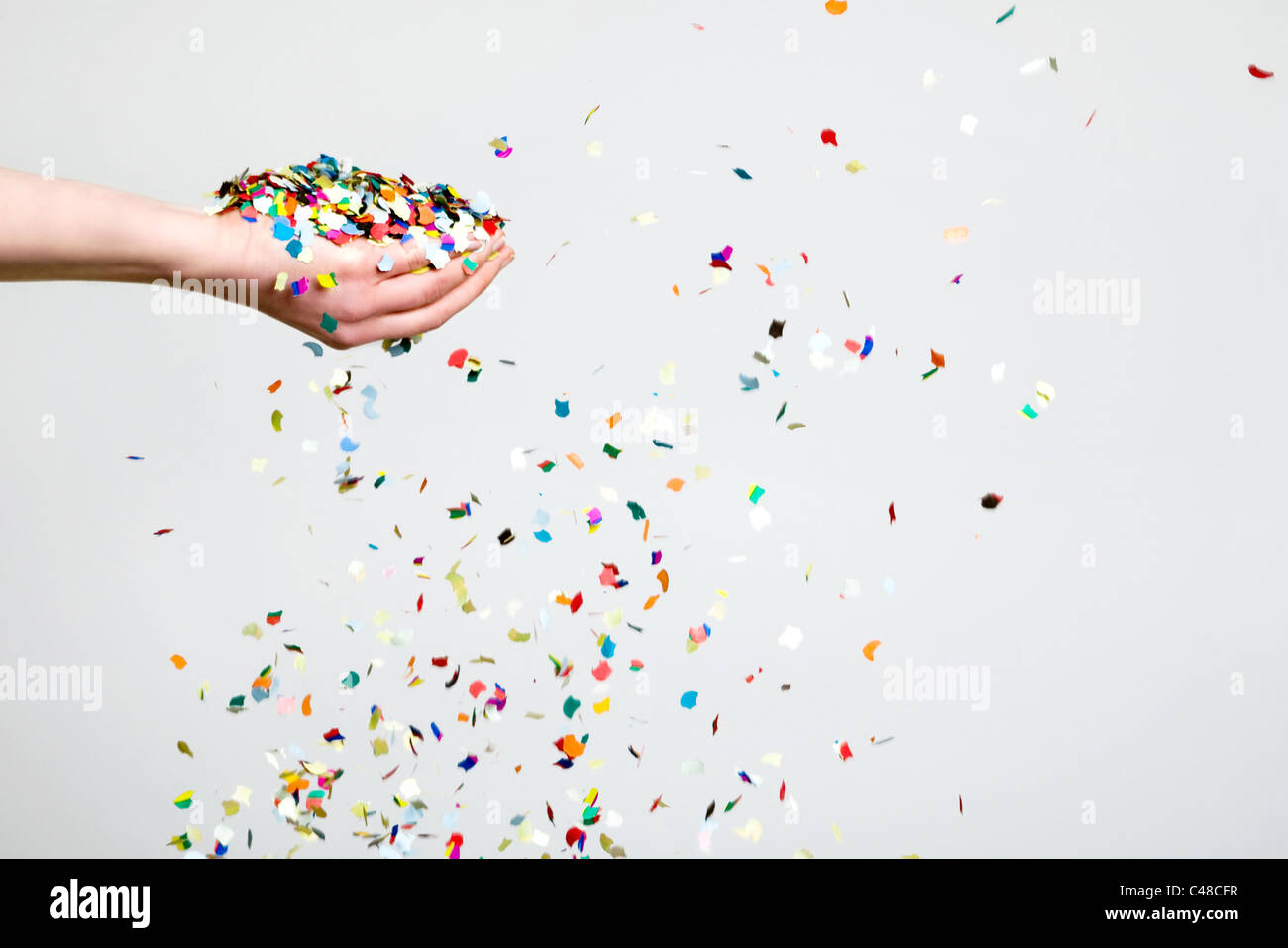 Hand throwing confetti hires stock photography and images Alamy