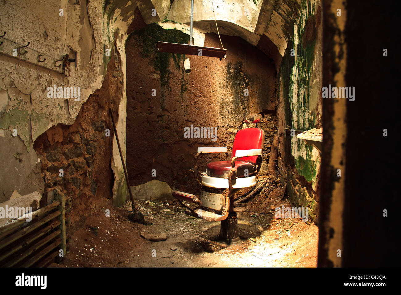 An old barber chair at Eastern State Penitentiary in Philadelphia, Pa. Stock Photo
