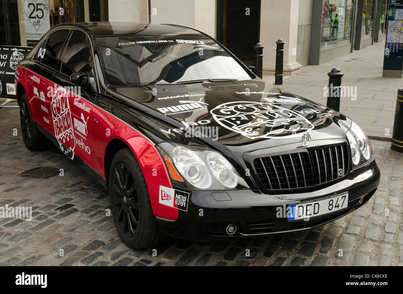Black and Red Maybach with Gumball 3000 decals, stickers and transfers at the Gumball rally Covent Garden Piazza London Stock Photo