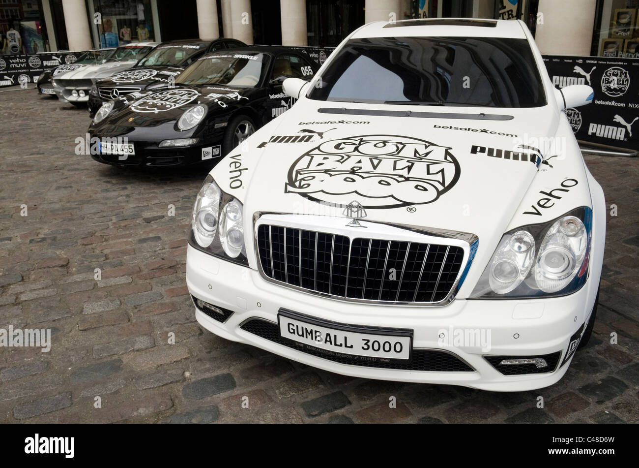 White Maybach with Gumball 3000 decals, stickers and transfers at the start of the Gumball rally Covent Garden Piazza London Stock Photo