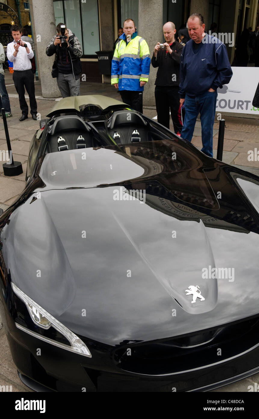 Black Peugeot sports car bonnet and badge on show at the Gumball rally 3000 Covent Garden Piazza London UK Stock Photo
